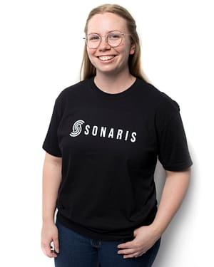 Female model wearing black t-shirt with white Sonaris logo